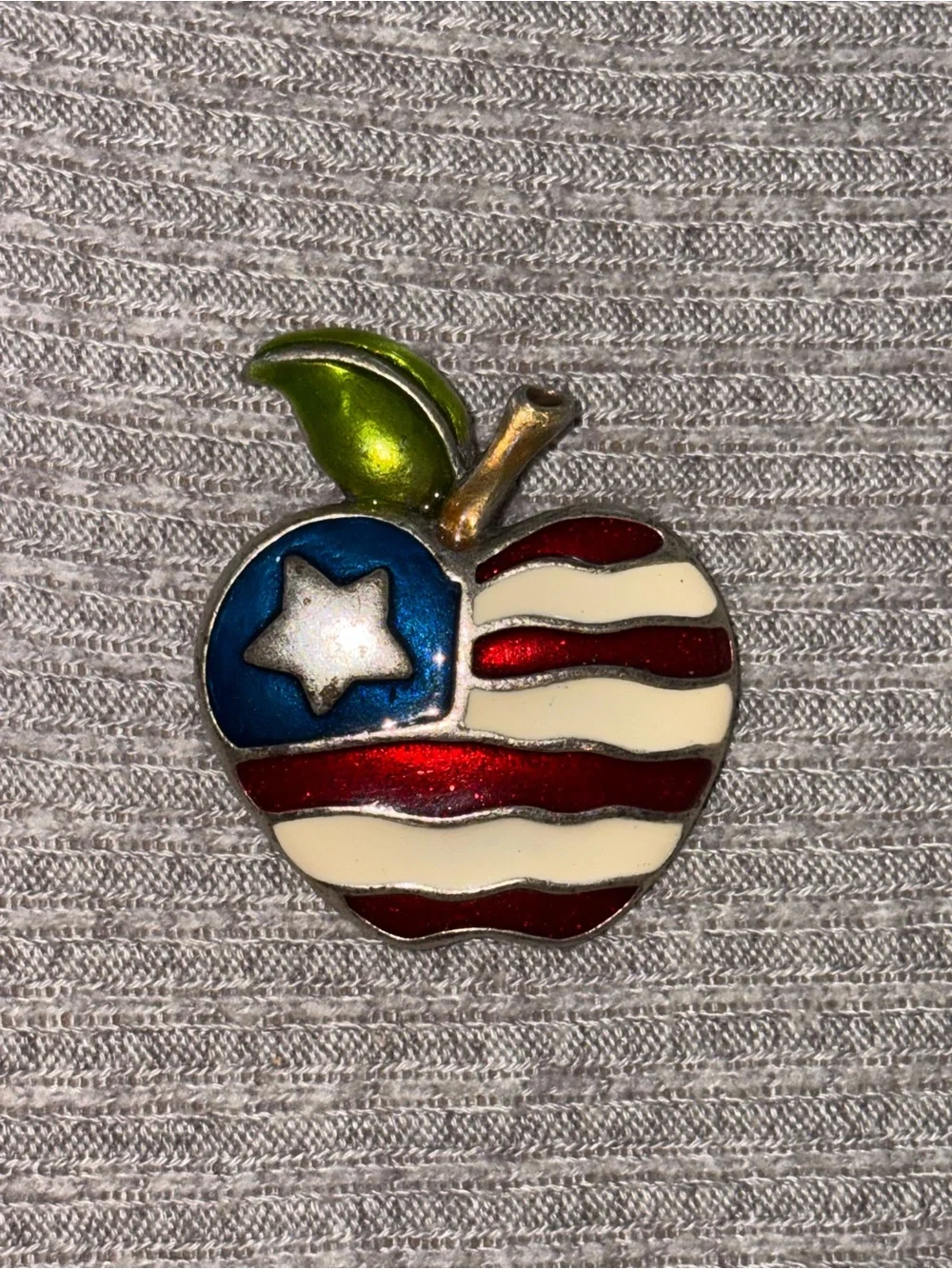 Vintage AJMC marked silver tone American flag apple brooch